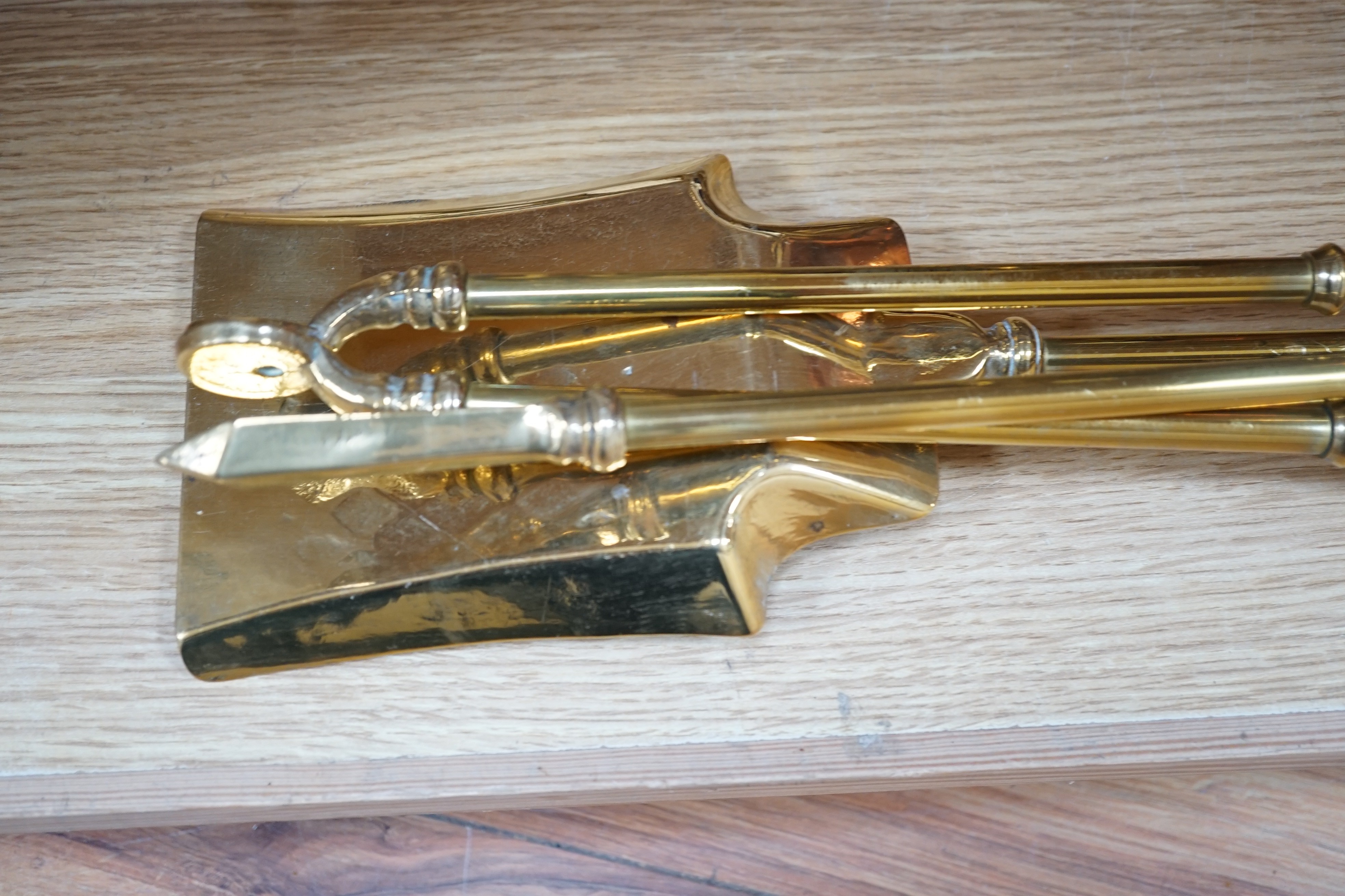A set of three Victorian brass fire irons, a pair of fire dogs and a copper log bin